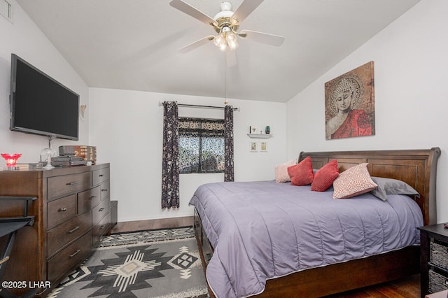 bedroom featuring vaulted ceiling, ceiling fan, and dark hardwood / wood-style flooring