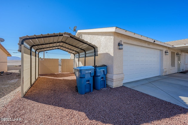 exterior space with a carport and a garage