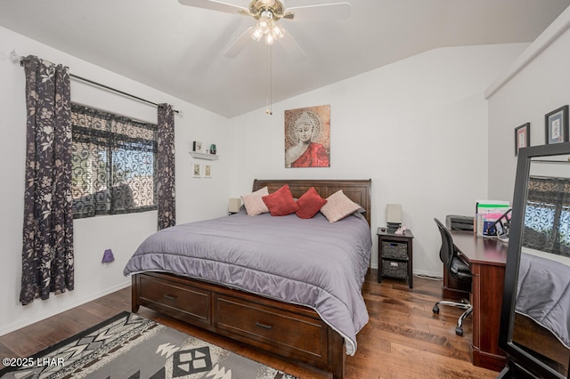 bedroom featuring multiple windows, hardwood / wood-style floors, vaulted ceiling, and ceiling fan