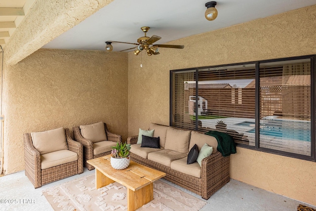 carpeted living room featuring ceiling fan