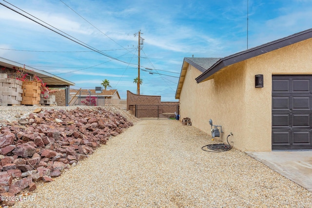 view of yard with fence and a gate