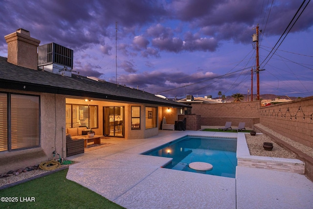 view of swimming pool featuring a patio area, a fenced backyard, a fenced in pool, and cooling unit