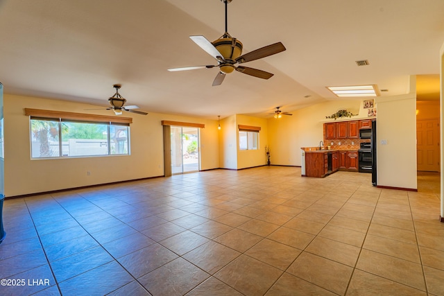 2335 Palo Verde Blvd N, Lake Havasu City, AZ 86404 - unfurnished living room with light tile patterned floors, vaulted ceiling, a ceiling fan, a sink, and baseboards