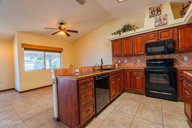 2335 Palo Verde Blvd N, Lake Havasu City, AZ 86404 - kitchen featuring black appliances, a sink, a peninsula, lofted ceiling, and tasteful backsplash