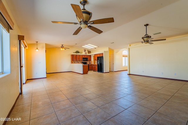 2335 Palo Verde Blvd N, Lake Havasu City, AZ 86404 - unfurnished living room featuring ceiling fan, vaulted ceiling, light tile patterned floors, baseboards, and arched walkways
