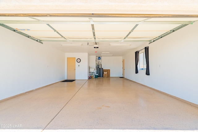 2335 Palo Verde Blvd N, Lake Havasu City, AZ 86404 - garage with a garage door opener, baseboards, and water heater