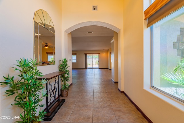2335 Palo Verde Blvd N, Lake Havasu City, AZ 86404 - hallway featuring arched walkways, tile patterned floors, and baseboards