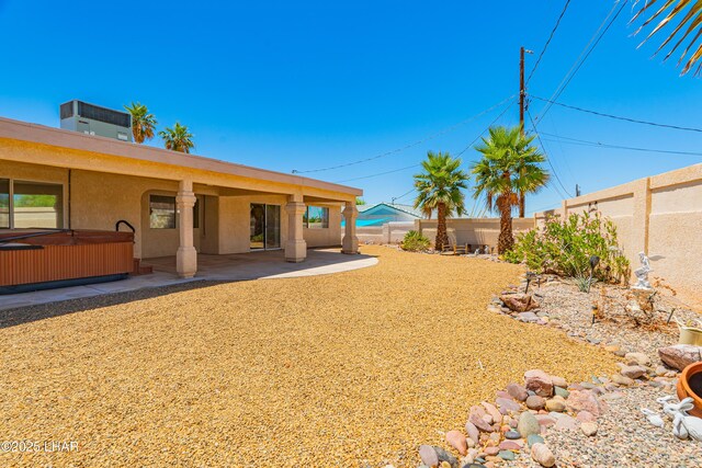 2335 Palo Verde Blvd N, Lake Havasu City, AZ 86404 - fenced backyard featuring a hot tub and a patio