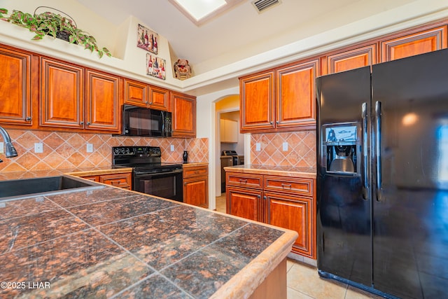 2335 Palo Verde Blvd N, Lake Havasu City, AZ 86404 - kitchen featuring black appliances, a sink, tile countertops, brown cabinets, and backsplash