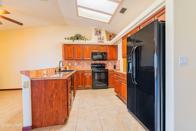 2335 Palo Verde Blvd N, Lake Havasu City, AZ 86404 - kitchen with black appliances, a sink, vaulted ceiling, light tile patterned flooring, and tasteful backsplash