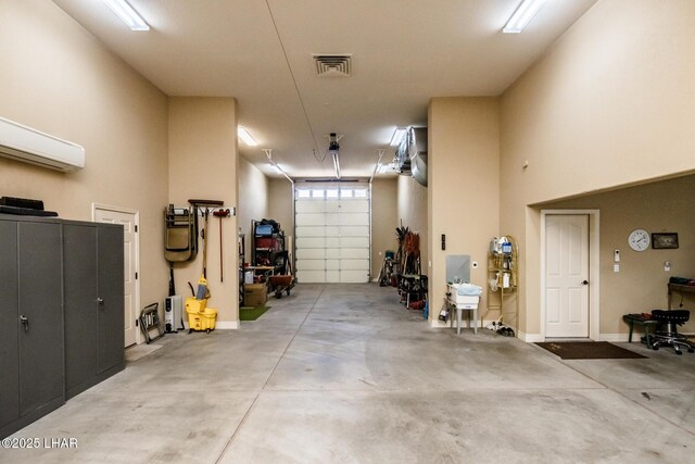 garage with a wall mounted air conditioner