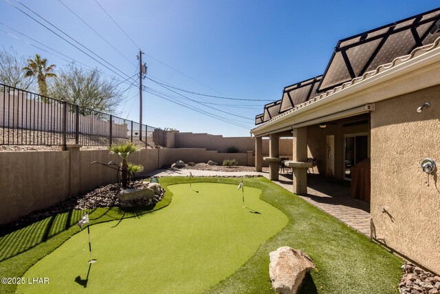 view of property's community with a patio area