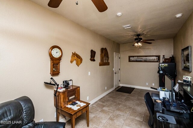 interior space with ceiling fan and tile patterned flooring