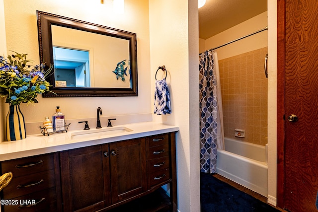 bathroom with shower / bath combination with curtain and vanity