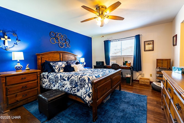 bedroom featuring ceiling fan and dark wood-style flooring