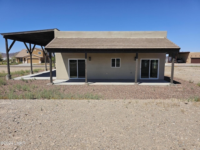 rear view of property featuring a patio