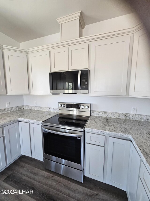 461 Paseo Grande, Quartzsite, AZ 85346 - kitchen with light stone counters, stainless steel appliances, dark hardwood / wood-style floors, and white cabinets