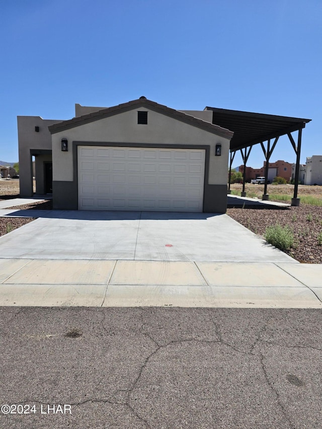 461 Paseo Grande, Quartzsite, AZ 85346 - view of front of house with a garage