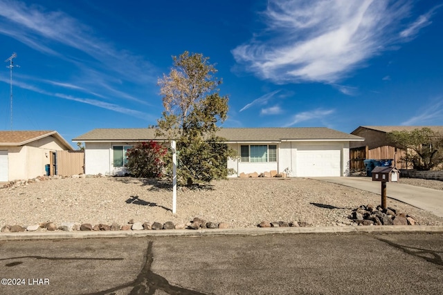 ranch-style home featuring a garage