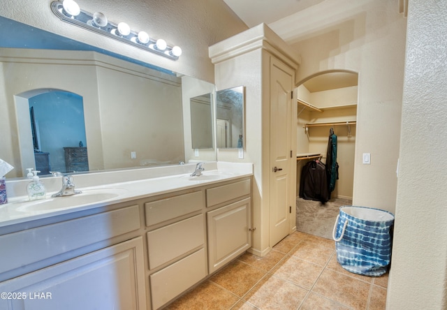 3000 Mirage Dr, Lake Havasu City, AZ 86404 - full bath featuring tile patterned flooring, double vanity, and a walk in closet