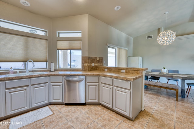 3000 Mirage Dr, Lake Havasu City, AZ 86404 - kitchen featuring stainless steel dishwasher, a sink, tile counters, high vaulted ceiling, and a chandelier