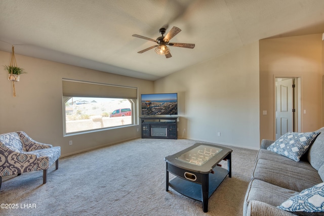 3000 Mirage Dr, Lake Havasu City, AZ 86404 - living room featuring vaulted ceiling, a ceiling fan, carpet flooring, baseboards, and a glass covered fireplace