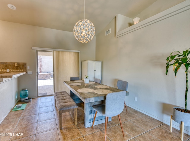 3000 Mirage Dr, Lake Havasu City, AZ 86404 - dining room with a chandelier, high vaulted ceiling, light tile patterned floors, and baseboards