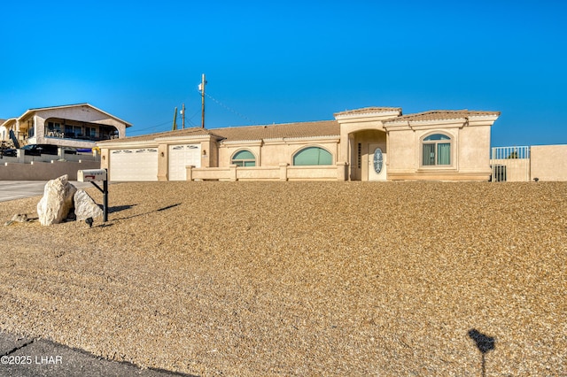 3000 Mirage Dr, Lake Havasu City, AZ 86404 - view of front facade featuring an attached garage, stucco siding, concrete driveway, and a tile roof