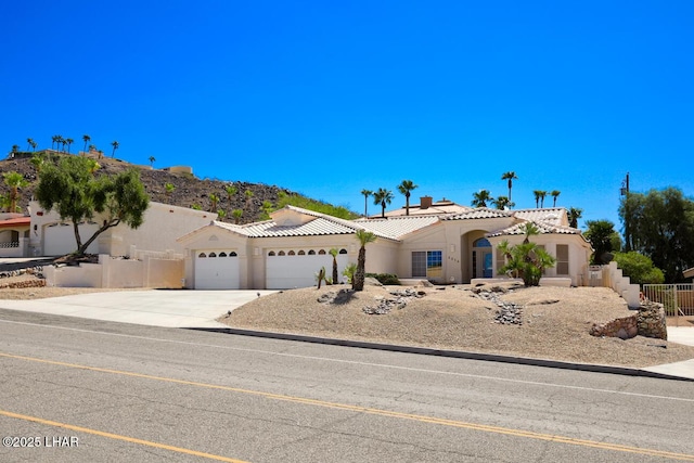 mediterranean / spanish-style house featuring a garage