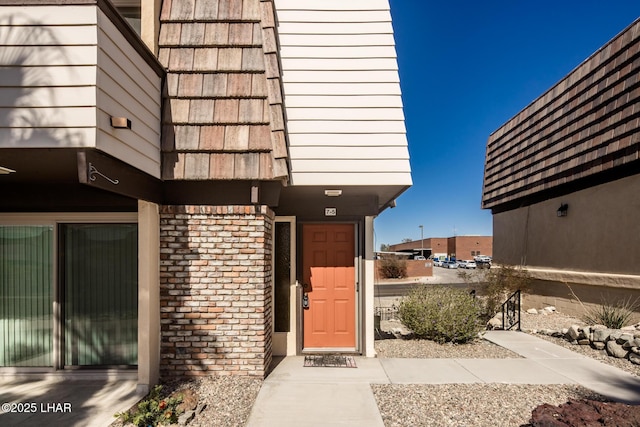 entrance to property with brick siding