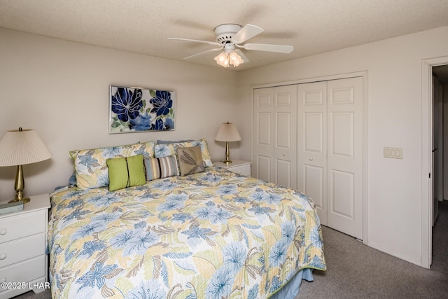 carpeted bedroom featuring a closet, a textured ceiling, and ceiling fan