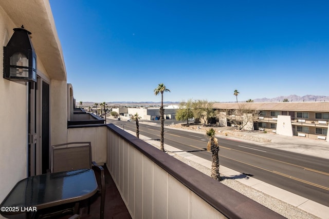 balcony featuring a mountain view and a residential view