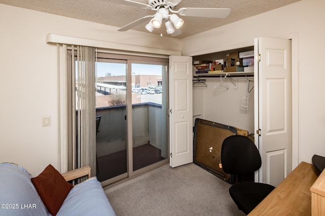 carpeted bedroom with ceiling fan, access to outside, a closet, and a textured ceiling