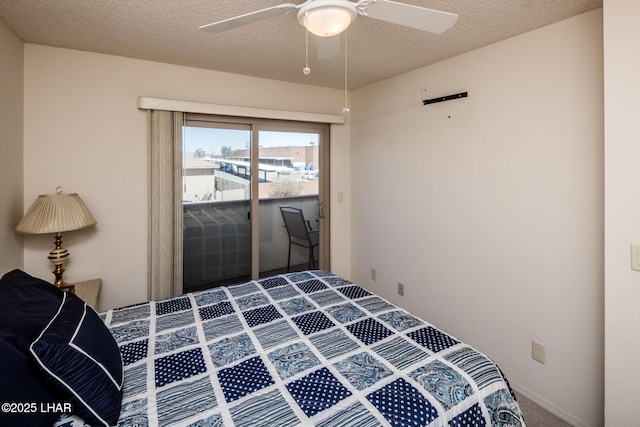 carpeted bedroom featuring access to outside, a ceiling fan, and a textured ceiling