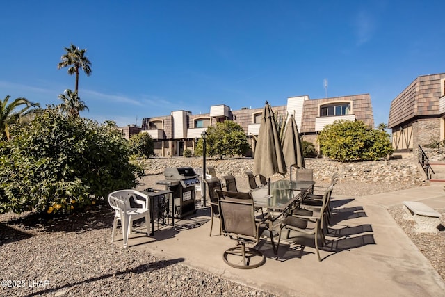 view of patio featuring area for grilling and outdoor dining area