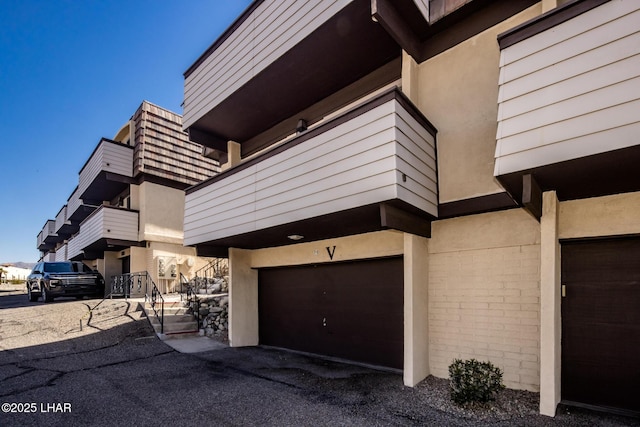 view of home's exterior featuring stucco siding and an attached garage