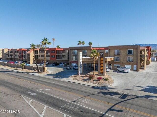 276 Lake Havasu Ave S Unit C19, Lake Havasu City, AZ 86403 - view of building exterior with uncovered parking