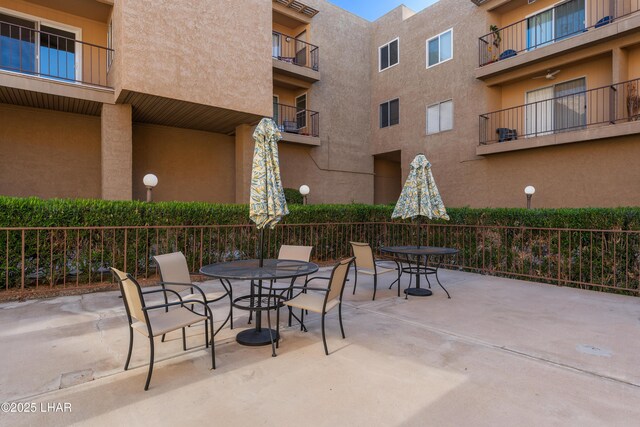 276 Lake Havasu Ave S Unit C19, Lake Havasu City, AZ 86403 - view of patio with outdoor dining area and fence
