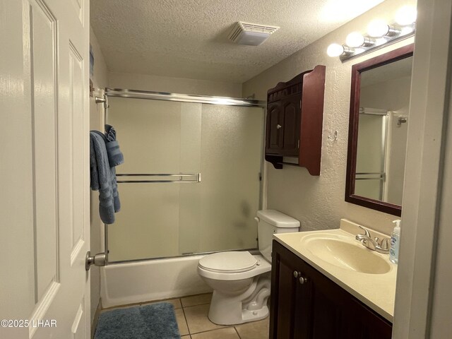 276 Lake Havasu Ave S Unit C19, Lake Havasu City, AZ 86403 - full bathroom with visible vents, toilet, a textured ceiling, tile patterned flooring, and a textured wall
