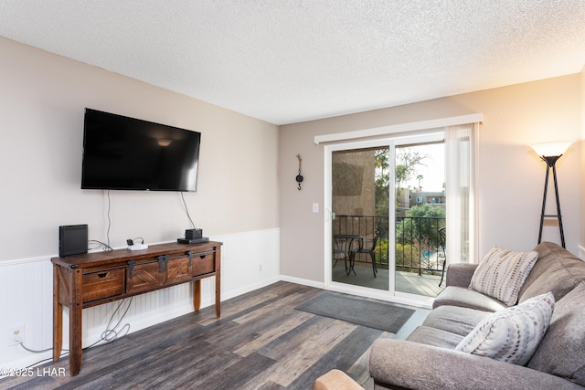276 Lake Havasu Ave S Unit C19, Lake Havasu City, AZ 86403 - living area with wainscoting, a textured ceiling, and dark wood-style flooring