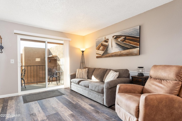 276 Lake Havasu Ave S Unit C19, Lake Havasu City, AZ 86403 - living room featuring a textured ceiling, baseboards, and wood finished floors