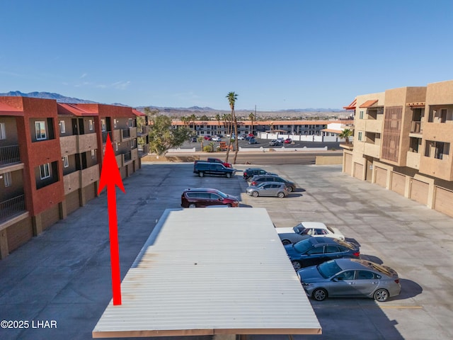 276 Lake Havasu Ave S Unit C19, Lake Havasu City, AZ 86403 - uncovered parking lot with a mountain view