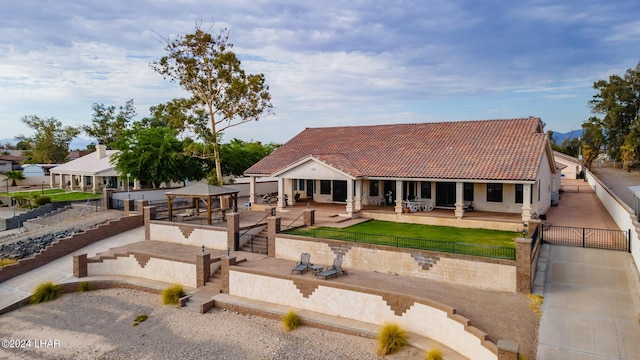 rear view of property featuring a patio area