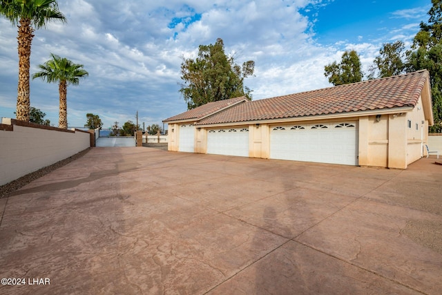 view of property exterior featuring a garage