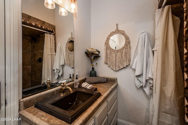 bathroom with vanity and walk in shower