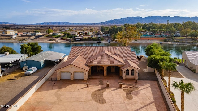 bird's eye view featuring a water and mountain view