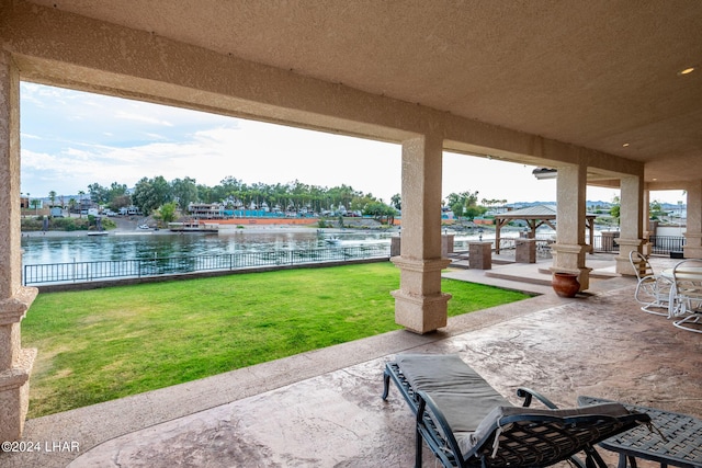 view of patio / terrace featuring a gazebo and a water view