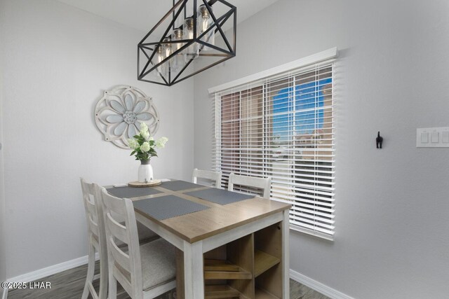 1650 Smoketree Ave S Unit 135, Avenue, Lake Havasu City, AZ 86403 - dining space featuring baseboards, wood finished floors, a chandelier, and plenty of natural light