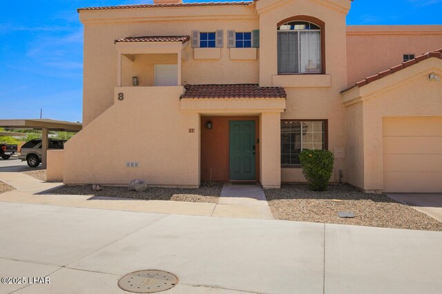 1650 Smoketree Ave S Unit 135, Avenue, Lake Havasu City, AZ 86403 - view of front facade featuring a tile roof and stucco siding