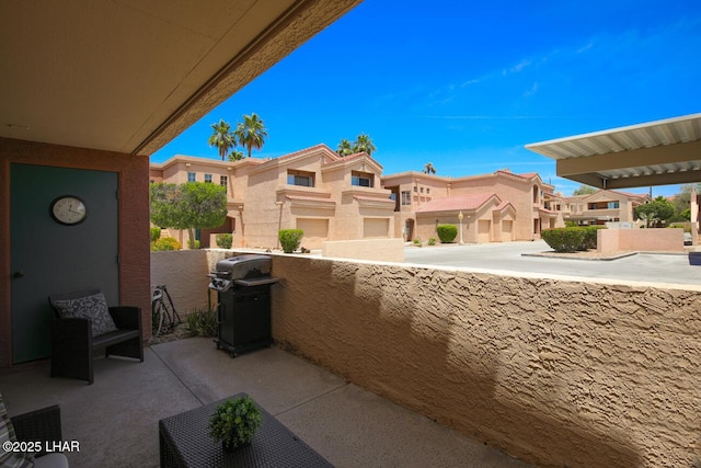 1650 Smoketree Ave S Unit 135, Avenue, Lake Havasu City, AZ 86403 - view of patio / terrace with grilling area, a residential view, and a balcony
